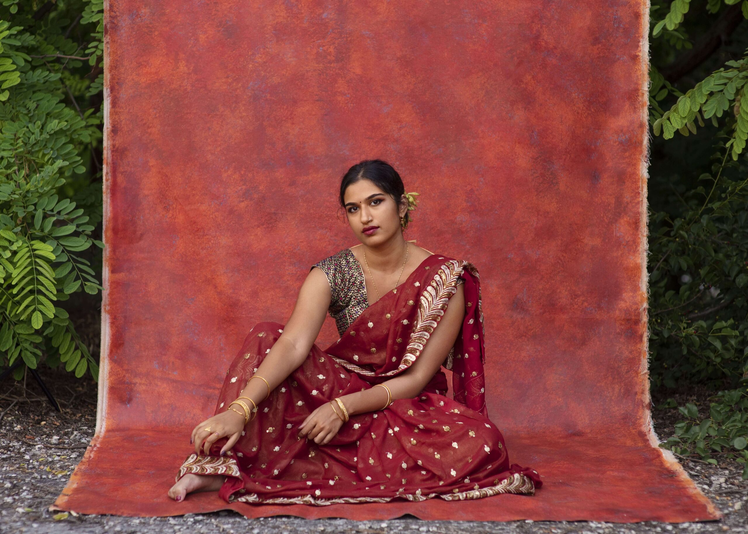 young-woman-posing-while-wearing-traditional-sari-garment-min-min